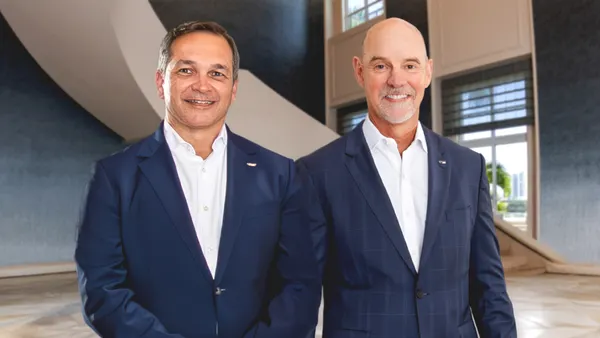 Ryder System COO John Diez and CEO Robert Sanchez side by side for a portrait.