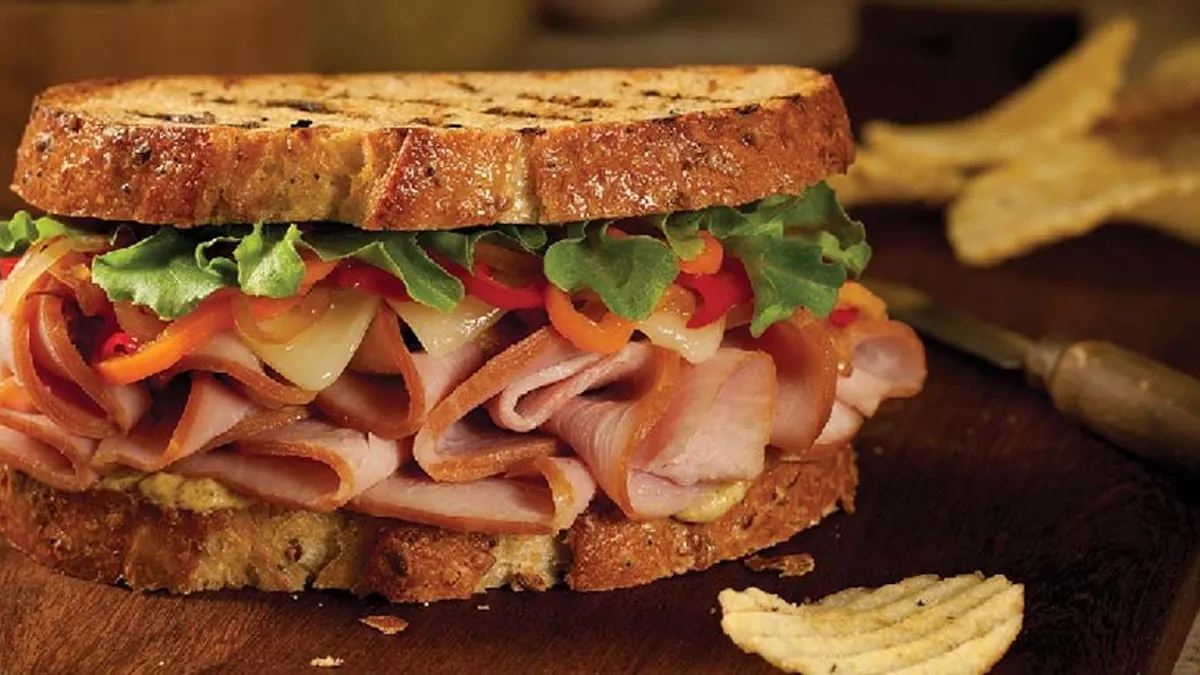 Sandwich on a wooden board.