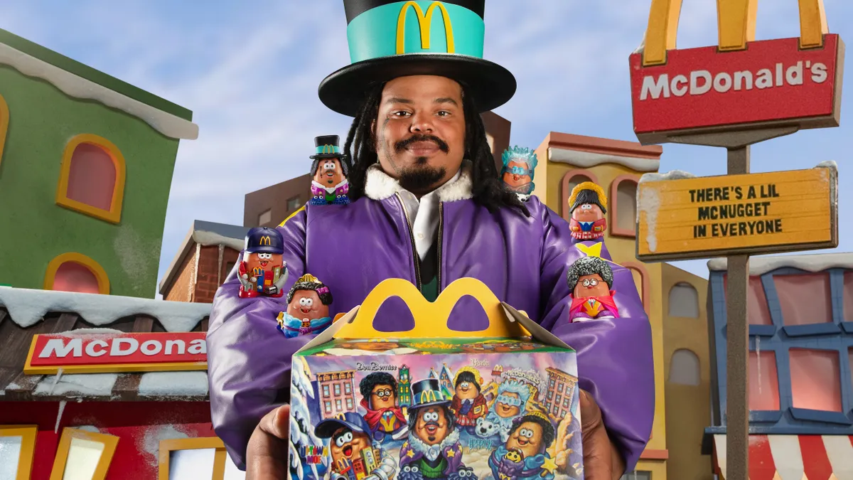 Influencer Kerwin Frost poses with McDonald's Happy Meal