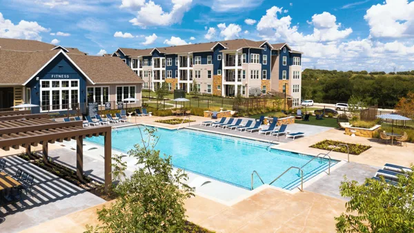 Aerial picture of garden-style apartments with pool.