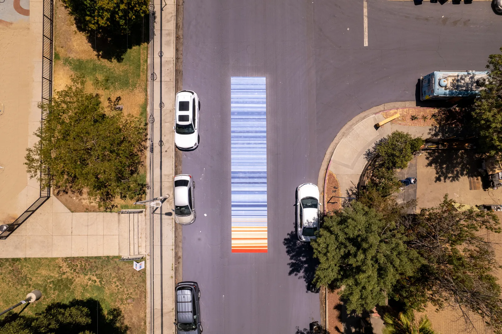 Aerial shot of red and blue stripes painted on a street