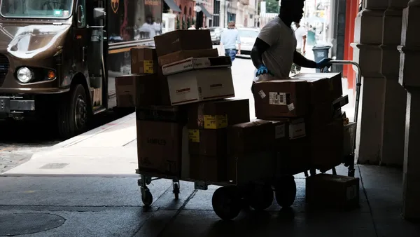 A UPS worker makes deliveries in Manhattan on July 24, 2023 in New York City.