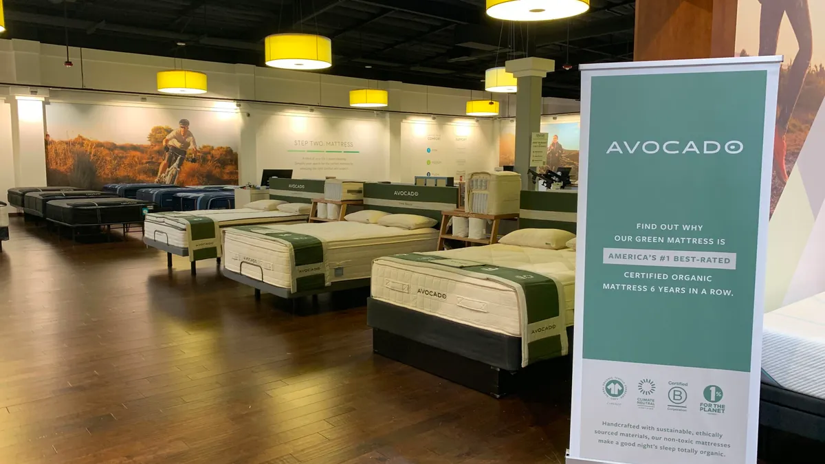 A mattress showroom with a sign saying Avocado