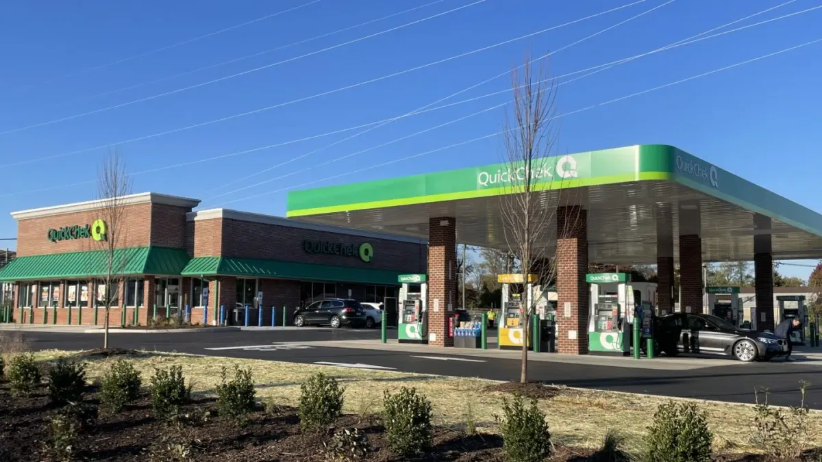 A photo of the exterior of a convenience store. Signs on the canopy and store read QuickChek.