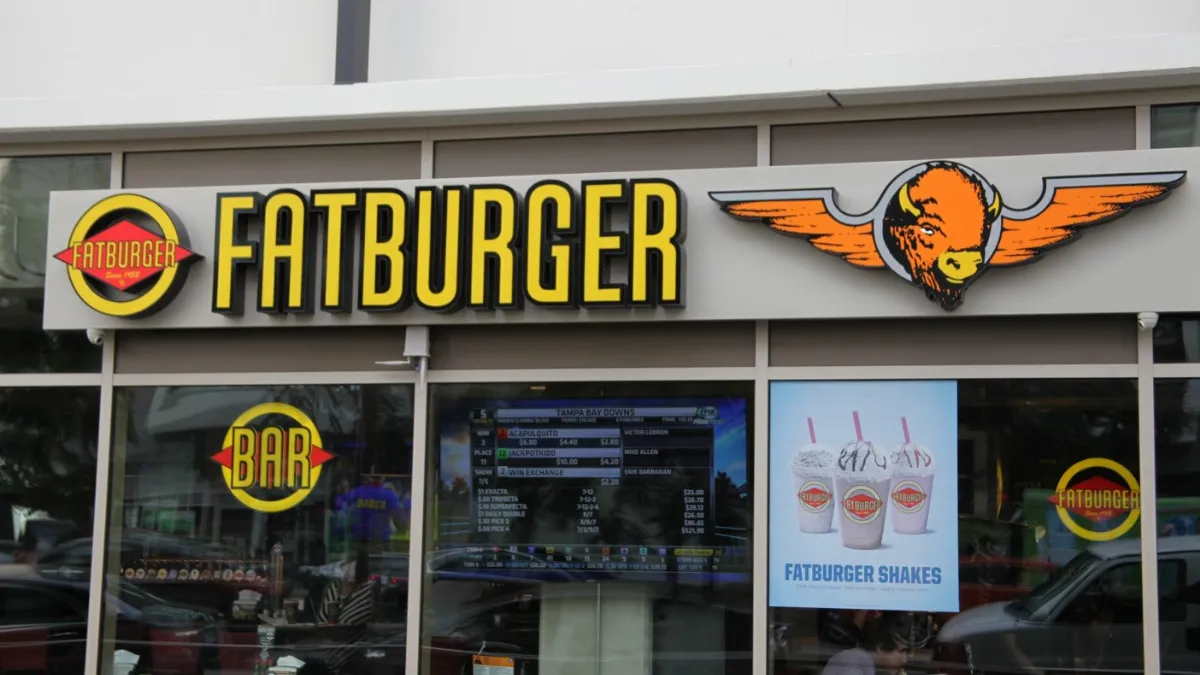 An image of a building with glass and a yellow sign that says Fatburger next to an image on orange buffalo