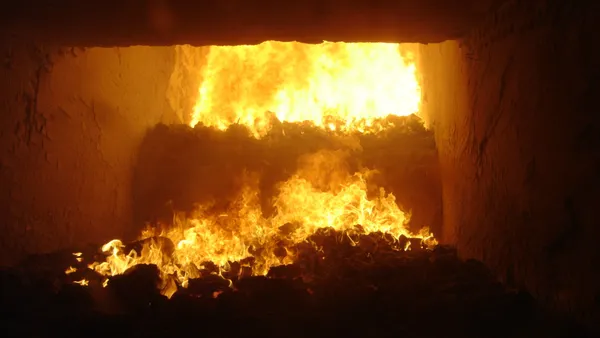 Waste burns in a fiery machine