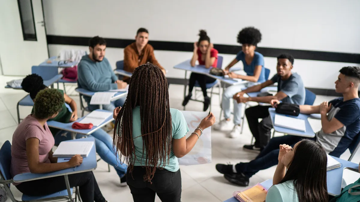 Teenager student doing a presentation in the classroom