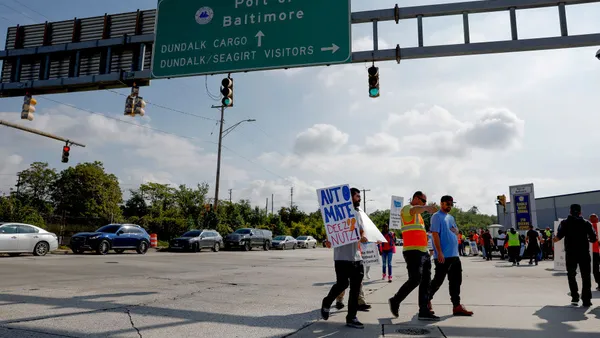 Longshoremen picket outside of an entrance to the Dundalk Marine Terminal in the Port of Baltimore.