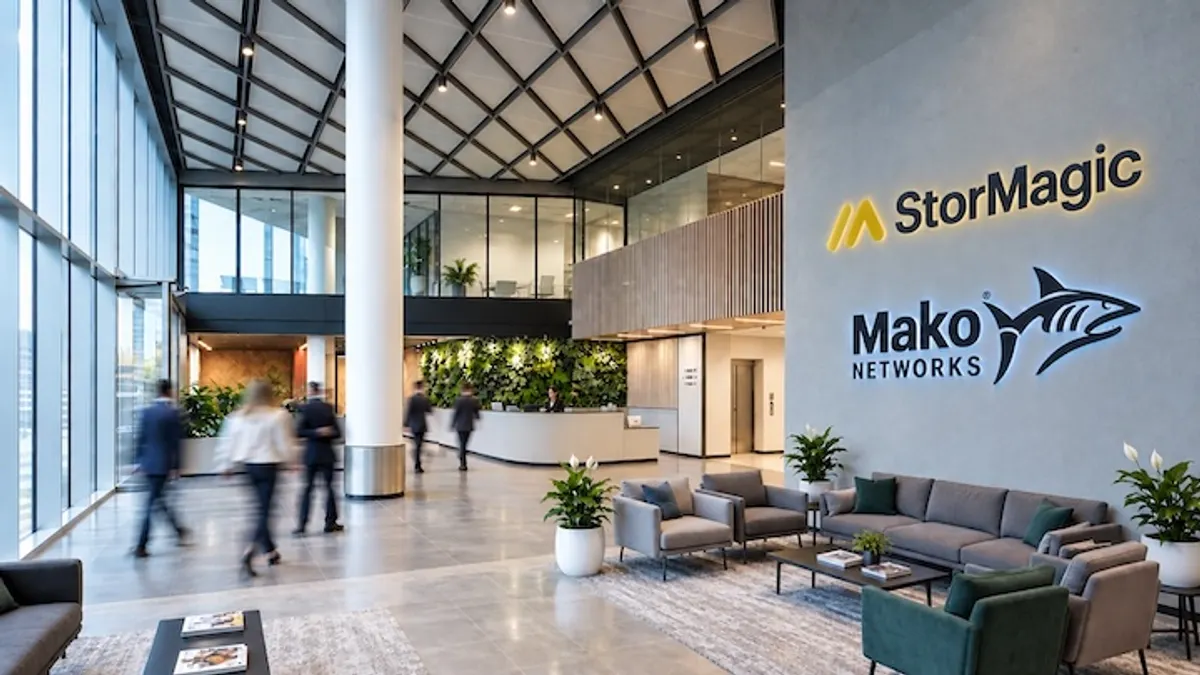 A lobby in an office building with the logos for StorMagica nd Mako Networks visible on the lobby wall.