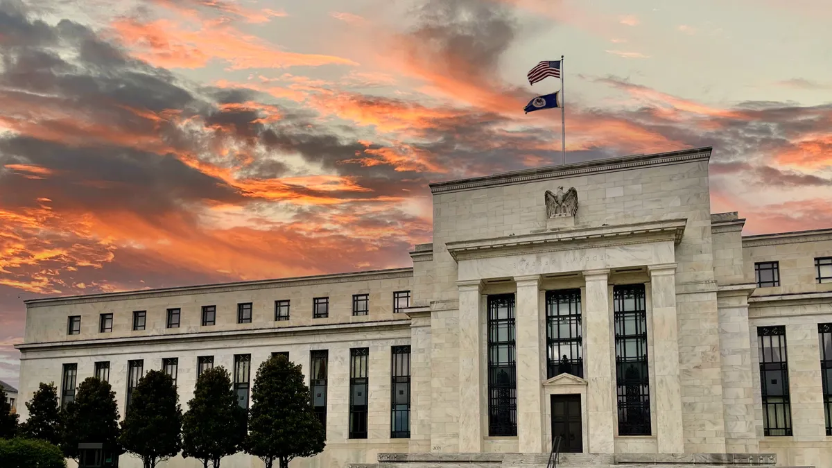 The Federal Reserve building at sunset.