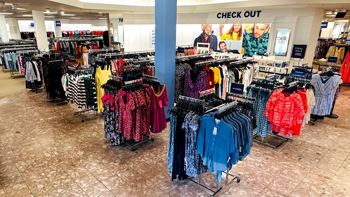 Interior shot of racks at a Belk Outlet store.