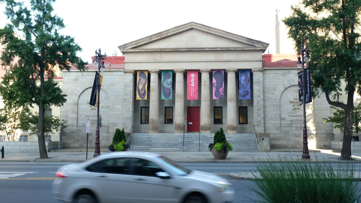 Flags outside of University of the Arts campus.