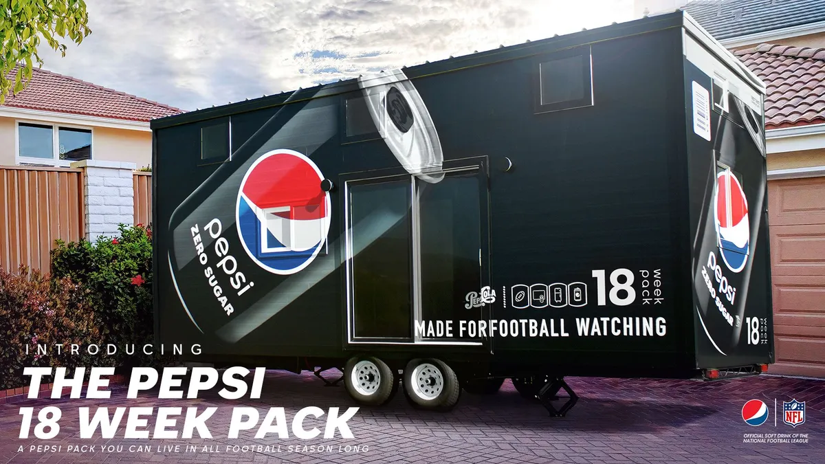 A black tiny home parked in a driveway displays a can of Pepsi Zero Sugar, accompanied by copy reading, "Introducing the Pepsi 18 Week Pack. A Pepsi pack you can live in all football season long."