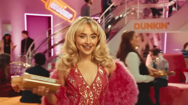 Sabrina Carpenter shakes espresso in a Dunkin ad