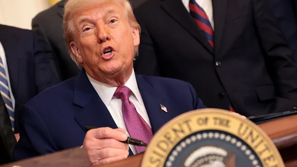 A man behind a desk.