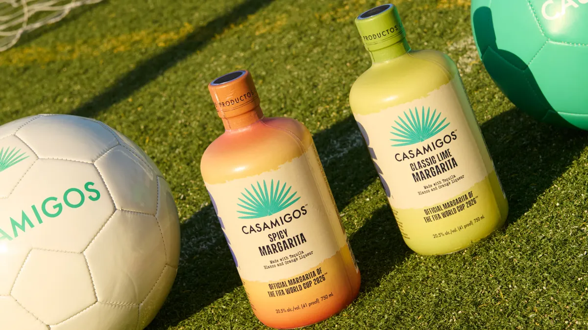 Two soccer balls surround two bottles of Casamigos premixed margarita, one spicy and one classic.