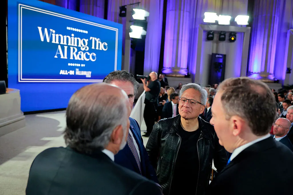 Tech executive Jensen Huang speaks to Trump administration officials at artificial intelligence event