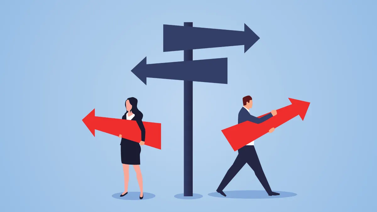 Male businessman and businesswoman choose different directions at the crossroads