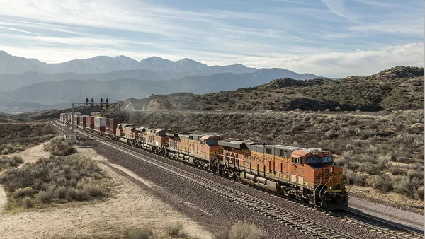 A train moving along the desert.