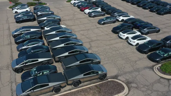 Unsold Tesla cybertrucks sit in the parking lot in a Michigan mall on June 2, 2025