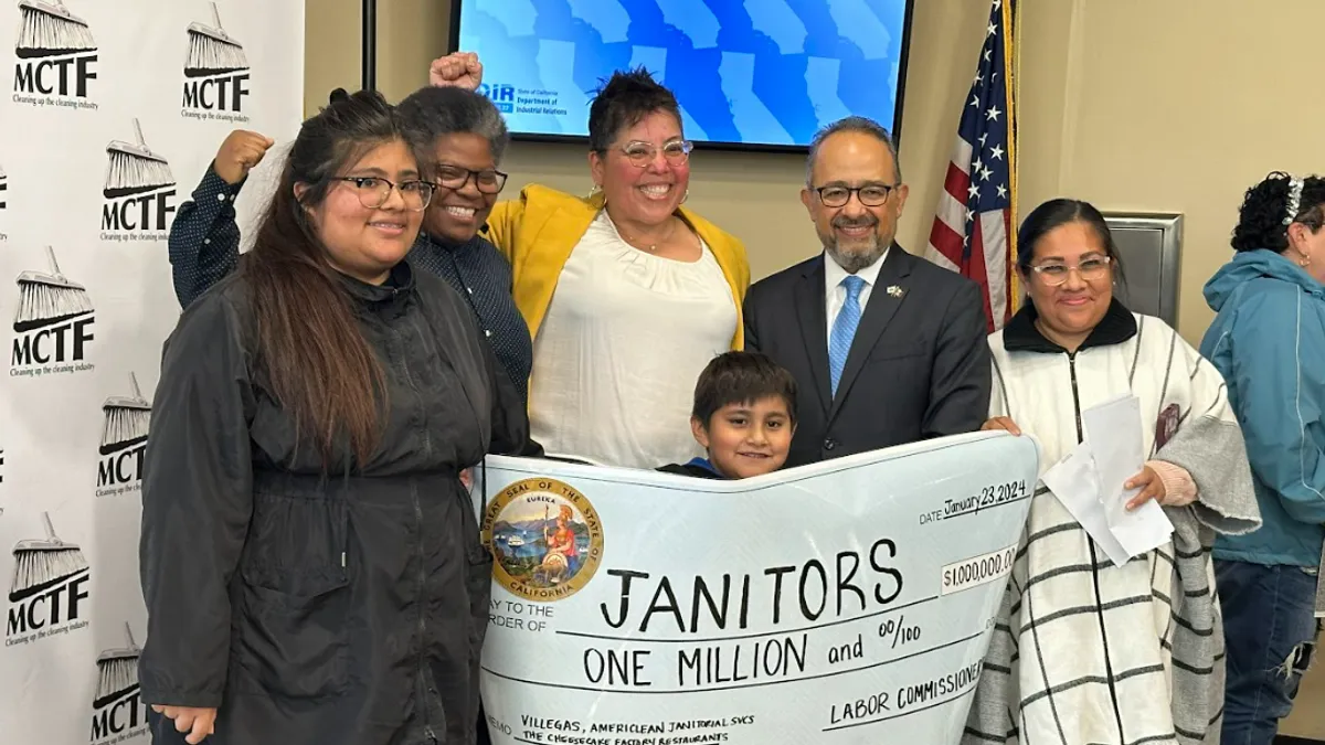 Individuals posing at a press conference hosted by the Maintenance Cooperation Trust Fund in San Diego on Jan. 23, 2024, celebrating a $1 million settlement against Cheesecake Factory.