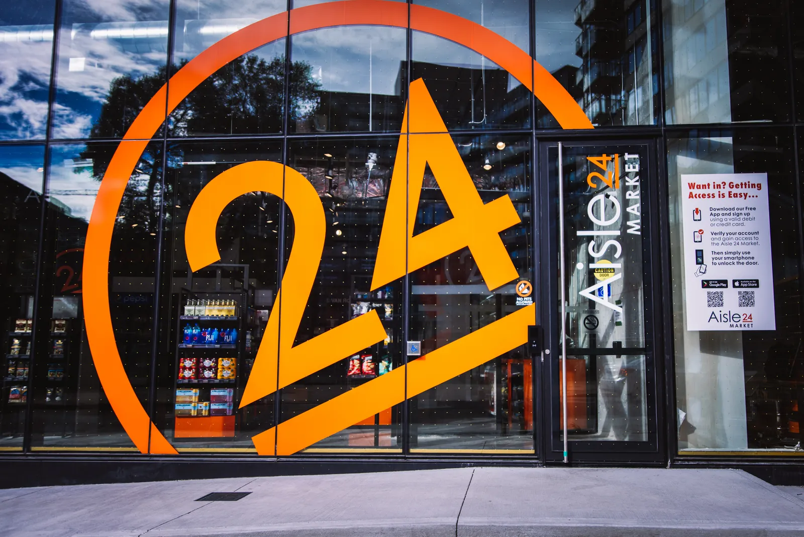 Exterior of a store with an orange logo that says, "Aisle 24."