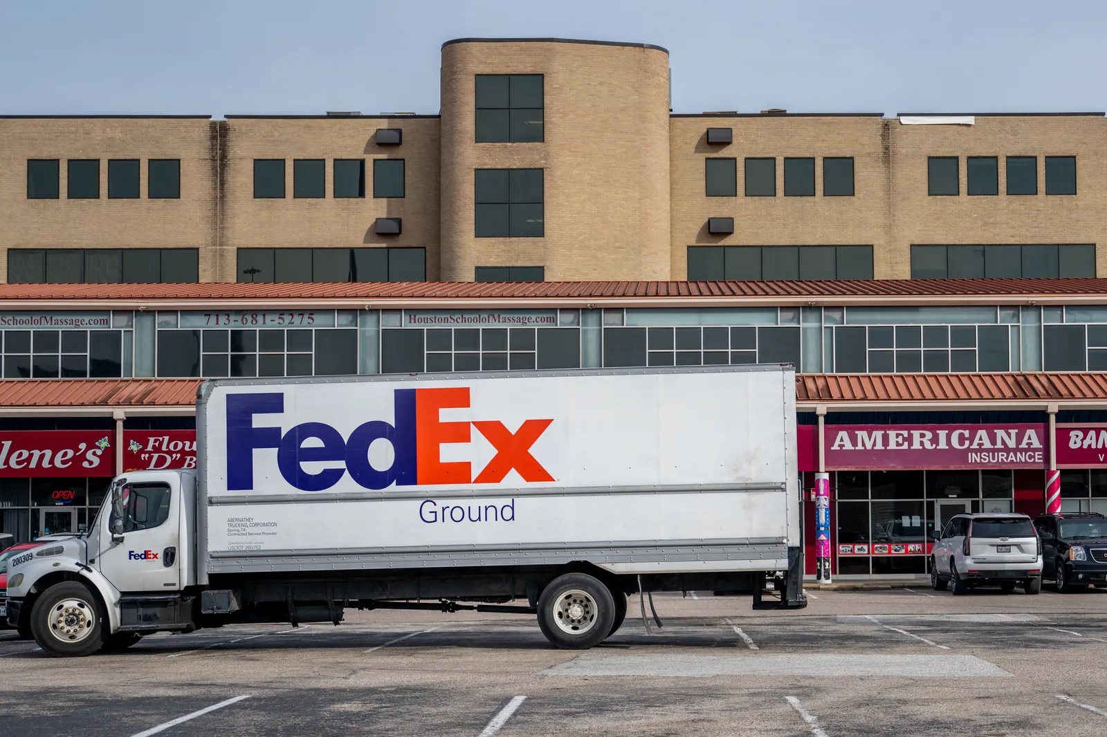 A FedEx truck parked in a parking lot near a FedEx facility on December 21, 2022 in Houston, Texas.