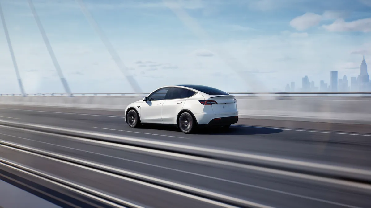 The Tesla Model Y traveling on a highway.