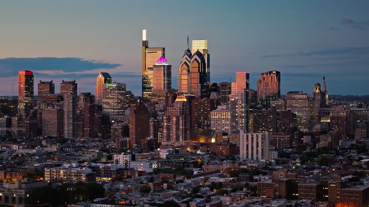 A shot at night of the Philadelphia skyline.