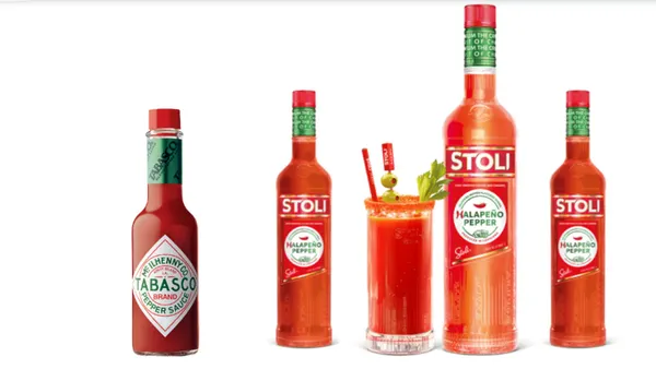 A tabasco hot sauce bottle is pictured next to Stoli's Halapeno Pepper Vodka.