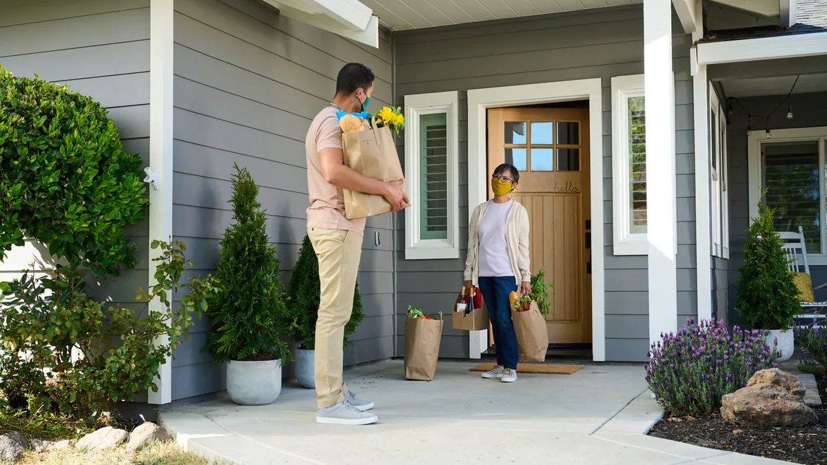 Instacart shopper delivering grocery order