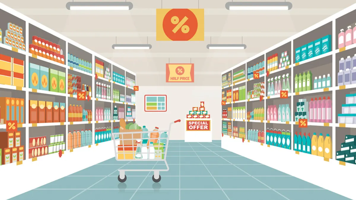 Supermarket aisle with shelves, grocery items and full shopping cart