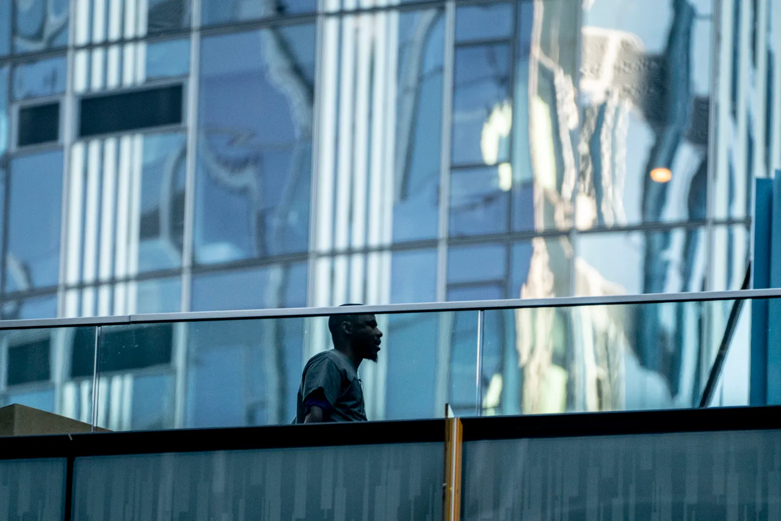 A person walks between buildings at the Amazon.com Inc. headquarters.