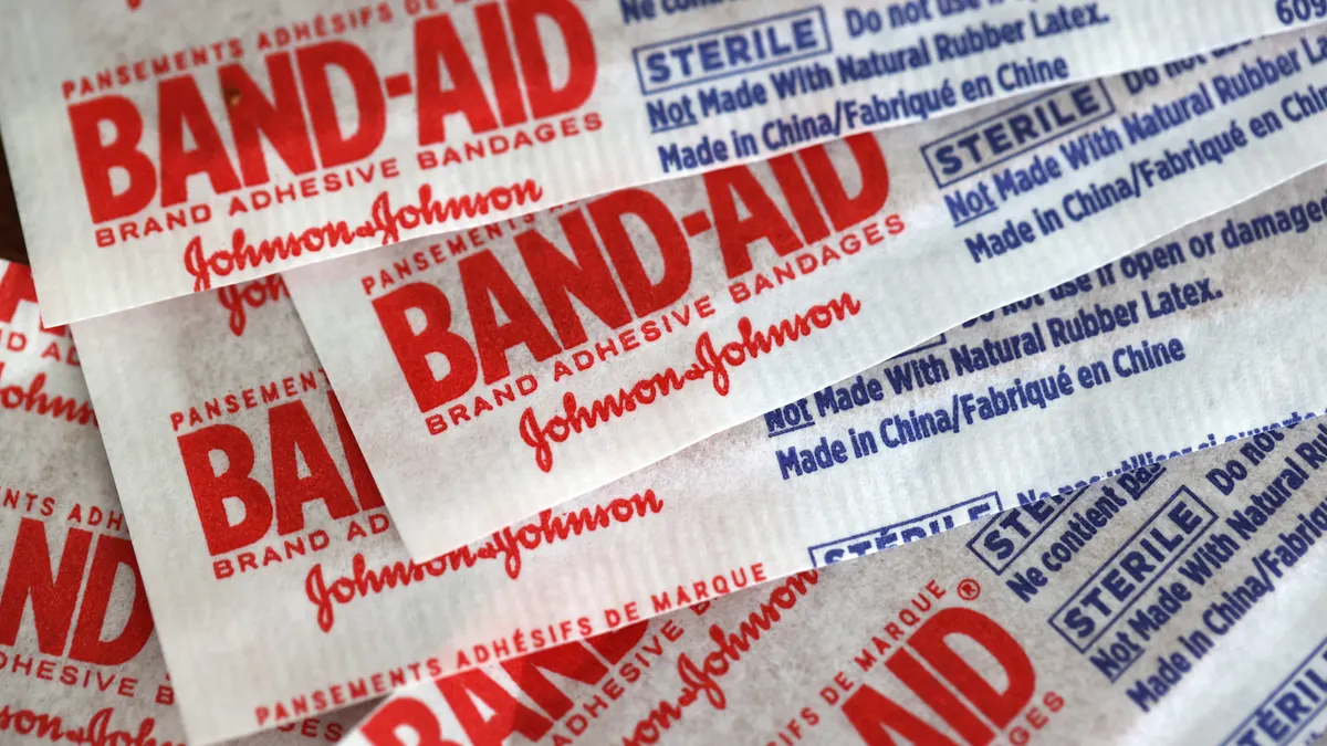 Johnson & Johnson band-aids are displayed on a table.