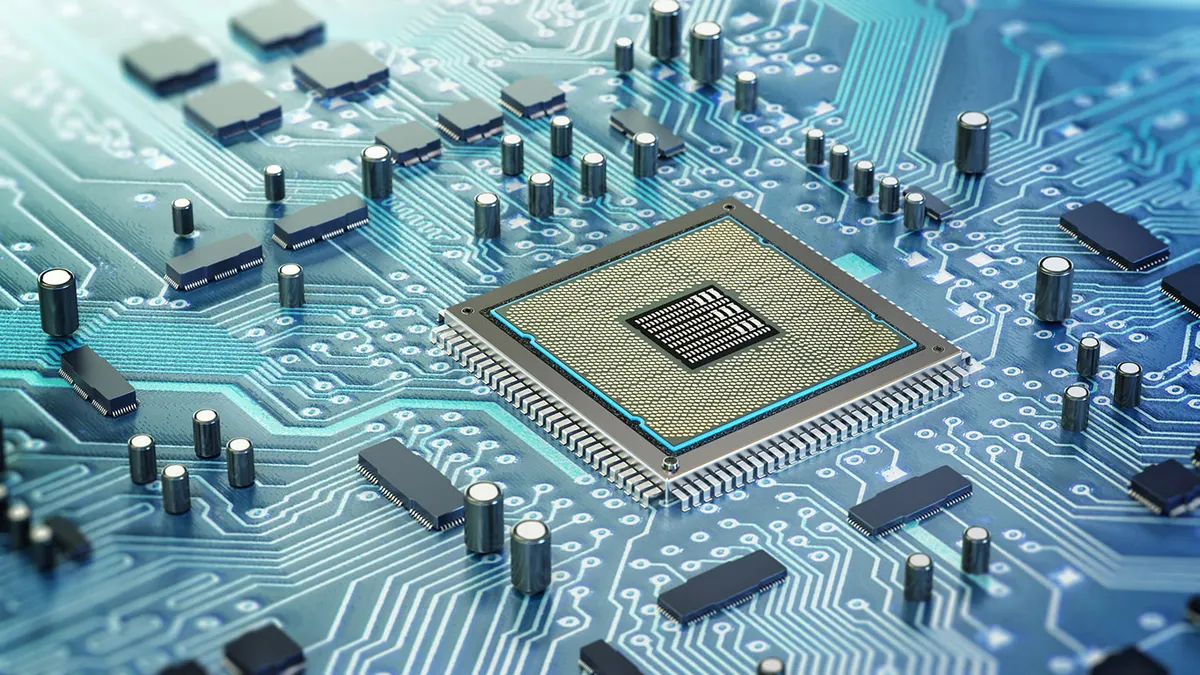 Detailed architecture of a computer chip nestled on a circuit board.