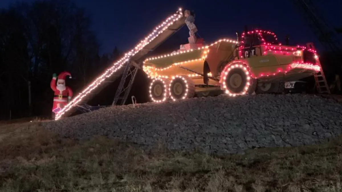 Santa on the roadside, loading up his CAT truck to deliver presents! The attraction is a staple in the local community.