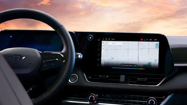 The infotainment screen in a Chevrolet vehicle showing Google Maps and Gemini dialog box.
