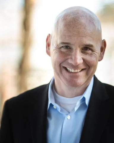 a headshot of Paul Carbone, new CFO of Panera Brands