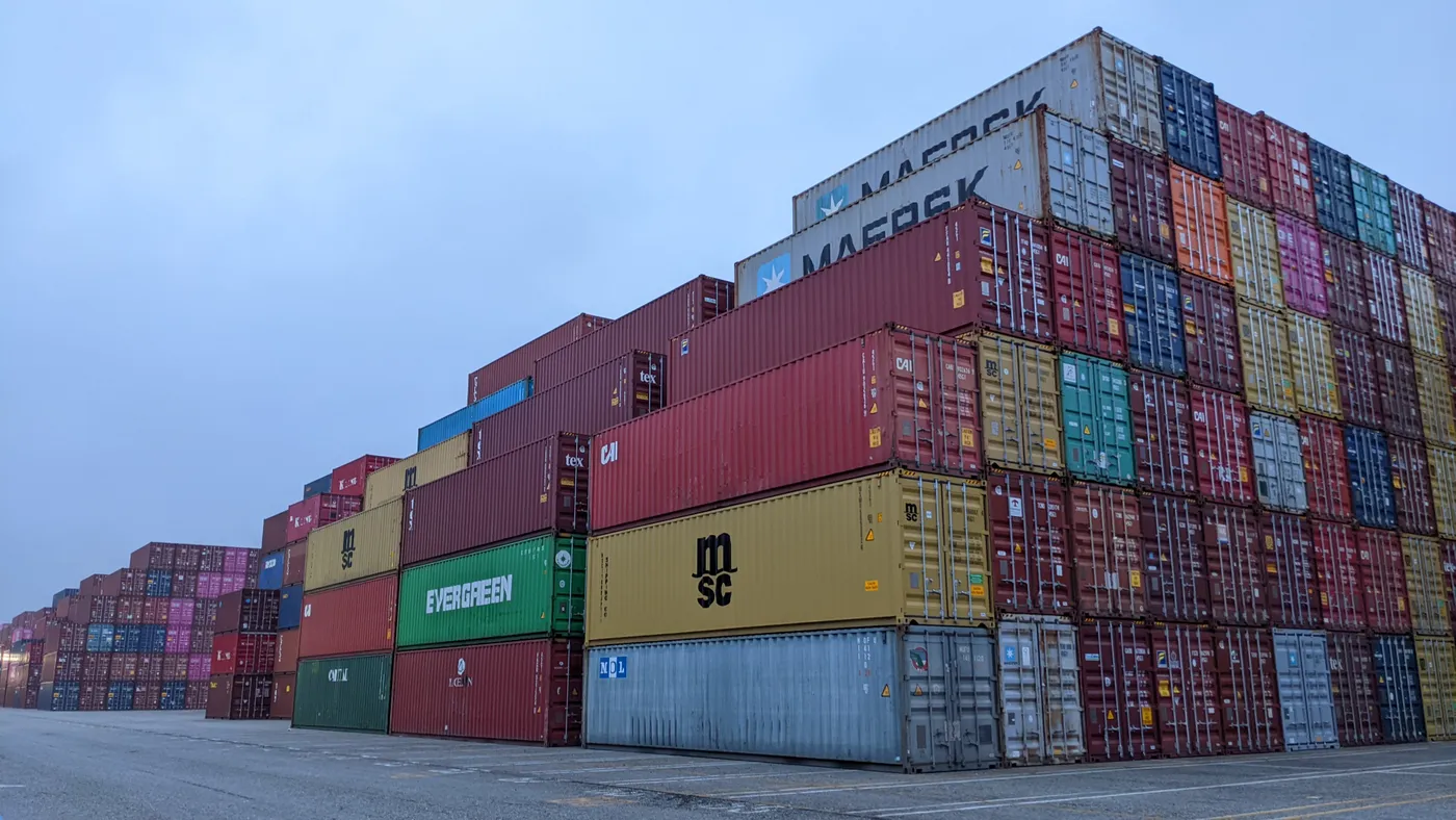 Empty container sit stacked at a pop-up container yard by the Port of Los Angeles on December 16, 2021.