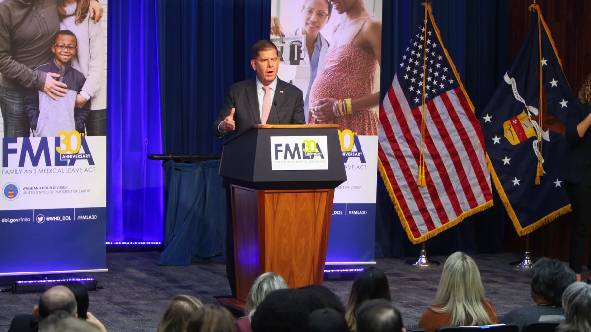 Marty Walsh speaks at a podium.