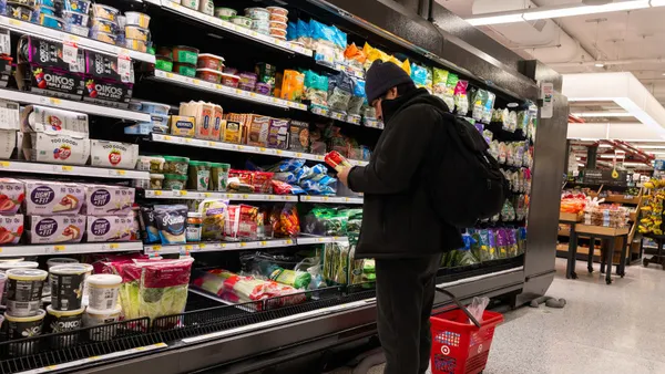 A person is seen shopping at a grocery store.
