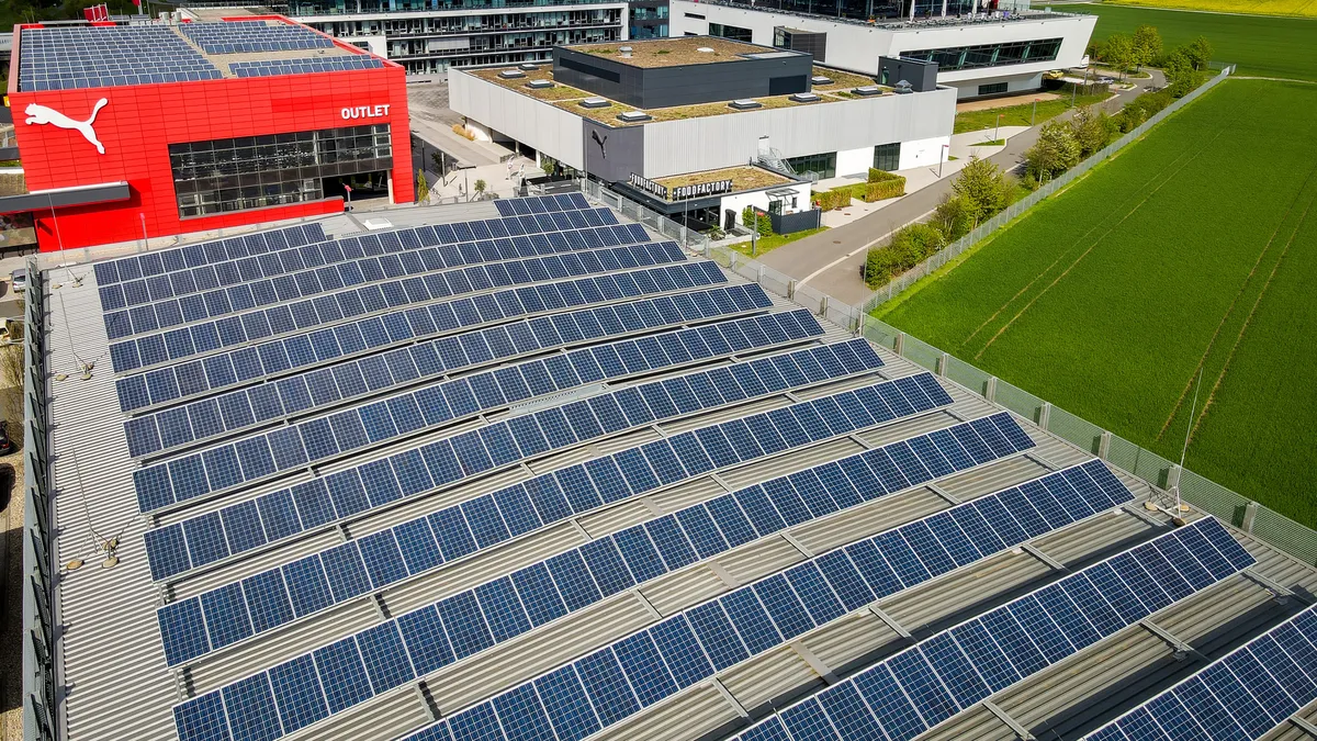 A Puma outlet is pictured next to solar panels.