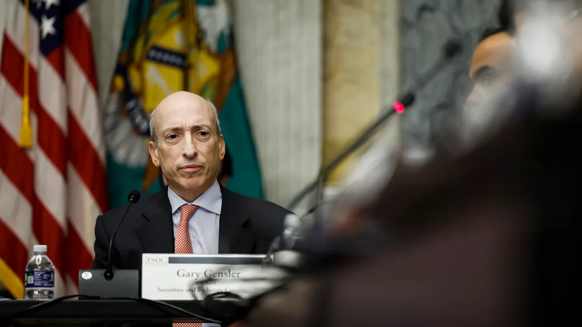 Securities and Exchange Commission (SEC) Chair Gary Gensler listens during a meeting.