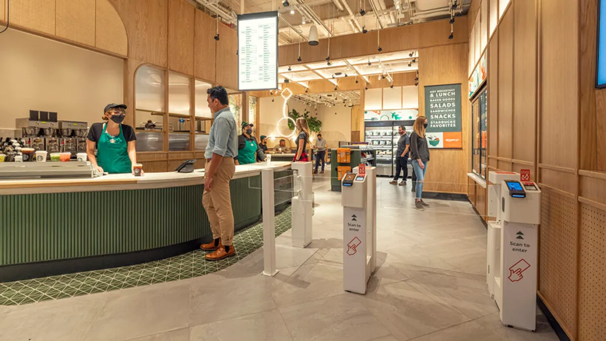 Starbucks introduces Amazon Go tech at NYC store.