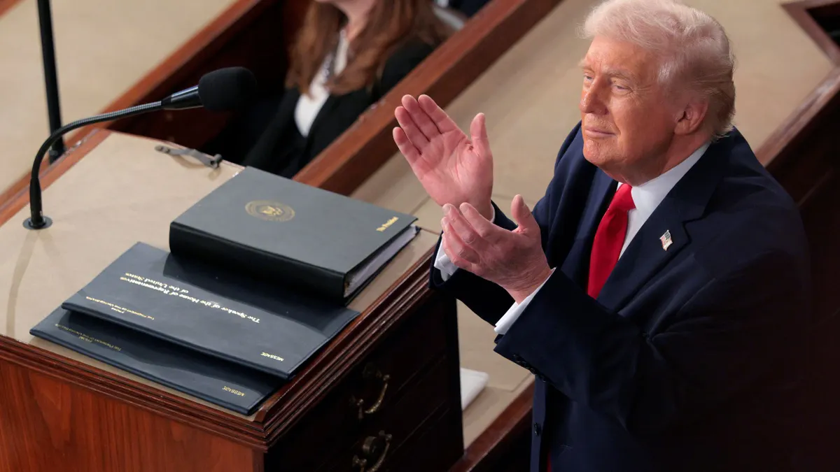 President Donald Trump applauds during his State of the Union address.