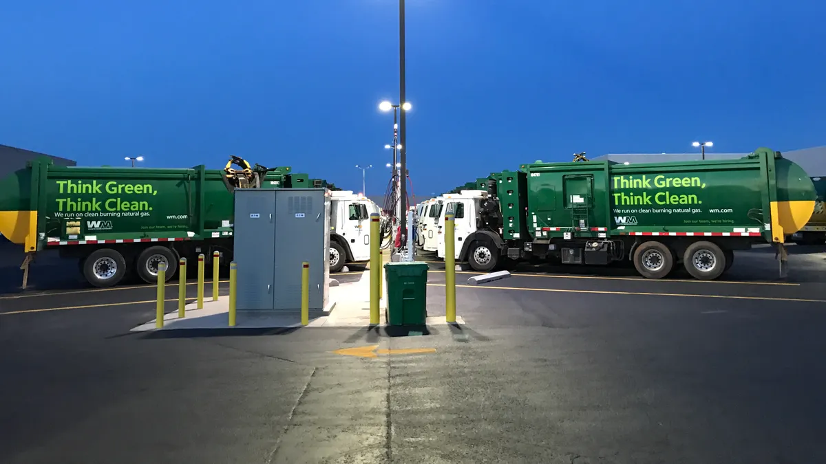 Waste Management CNG trucks in parking lot