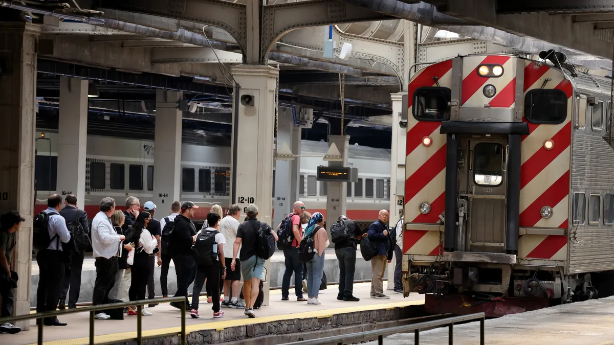 Passengers board a Metra commuter train at Union Station on September 15, 2022 in Chicago, Illinois.