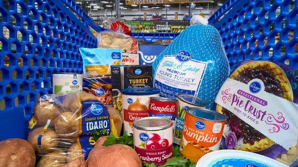 Thanksgiving meal ingredients in a shopping cart.
