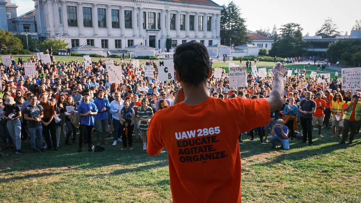 A group of University of California academic workers and supports gather at UC Berkeley to protest what they call poor pay and benefits.