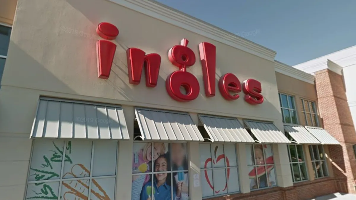 Exterior of a supermarket with a sign that says "ingles" in red letters.